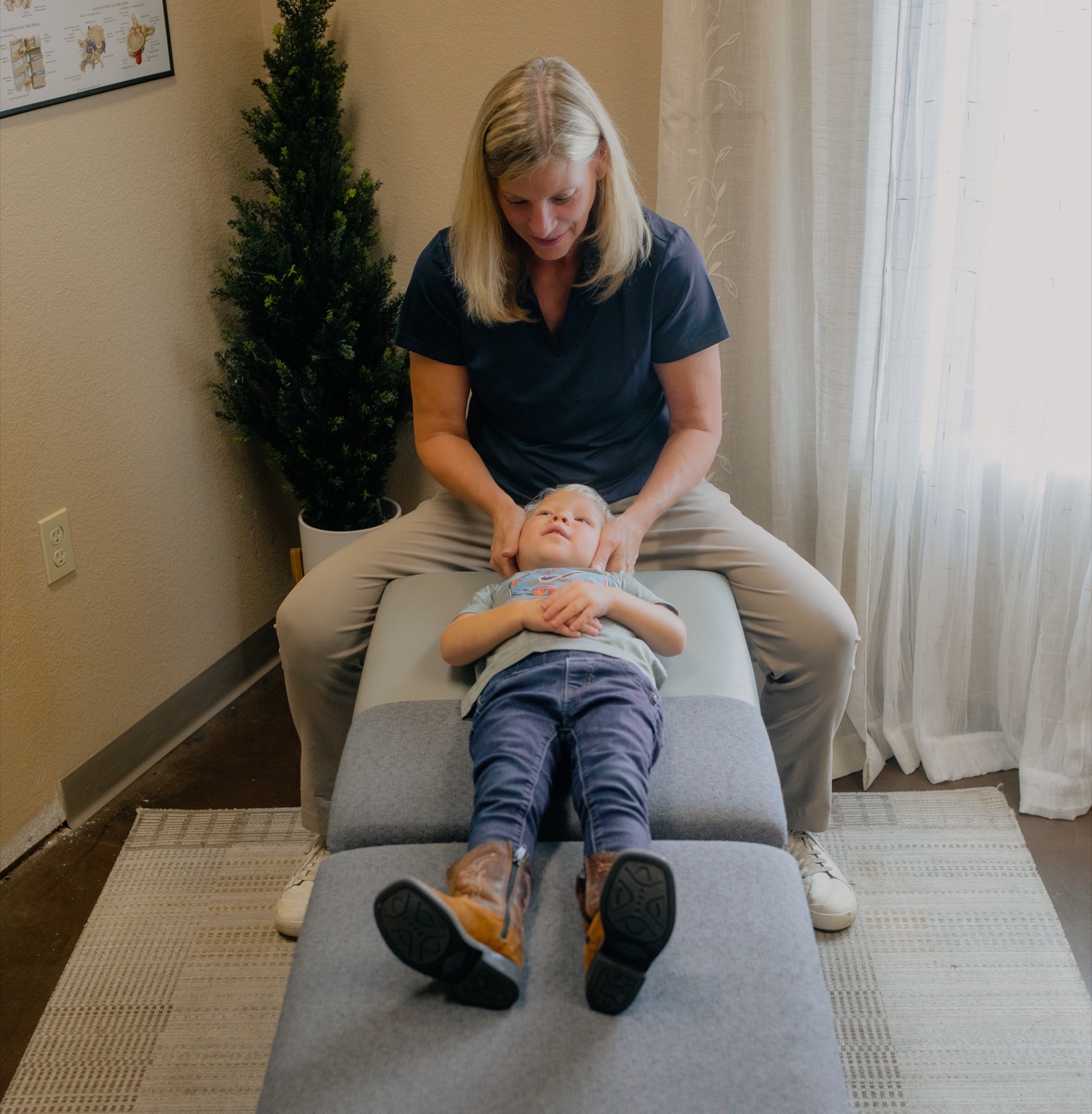 Dr. Emily caring for a young child in the calm, welcoming treatment room.